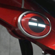 The light-stripe changes colors based on charge. This is also where the electromagnetic clamp holding the bike together is located.